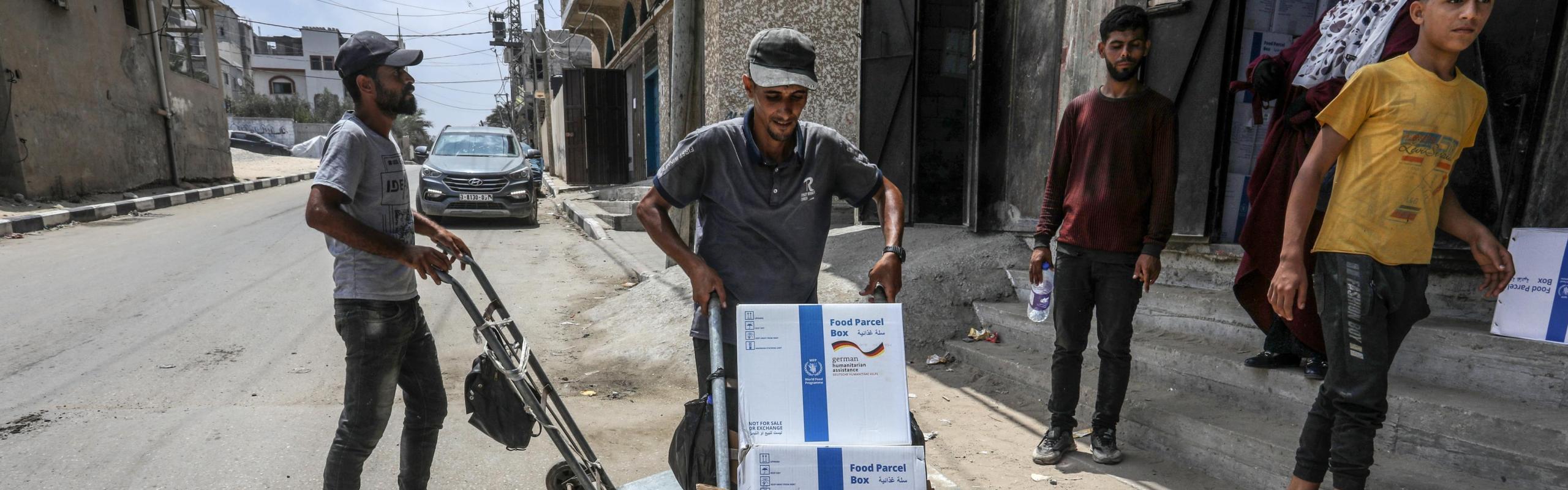 The World Food Program begins distributing German aid to the displaced and local residents in Deir al-Balah in the central Gaza Strip, on June 9, 2024.